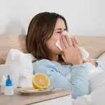 Antibiotica - Vrouw in bed met een zakdoek