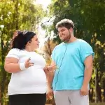 Overgewicht - man en vrouw met overgewicht in sportieve kleding